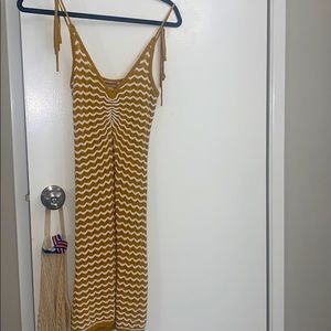 Yellow knit beach throw over